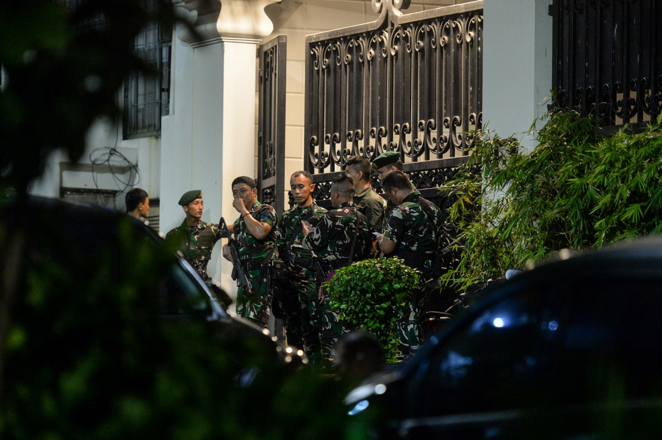 External reinforcements: A group of soldiers stands guard on Wednesday at the front gates of a luxury house in South Jakarta&rsquo;s upscale Kebayoran Baru neighborhood identified as the private residence of Febrie Ardiansyah, who resigned as assistant attorney general for special crimes on Friday amid an ongoing corruption investigation by the National Police.