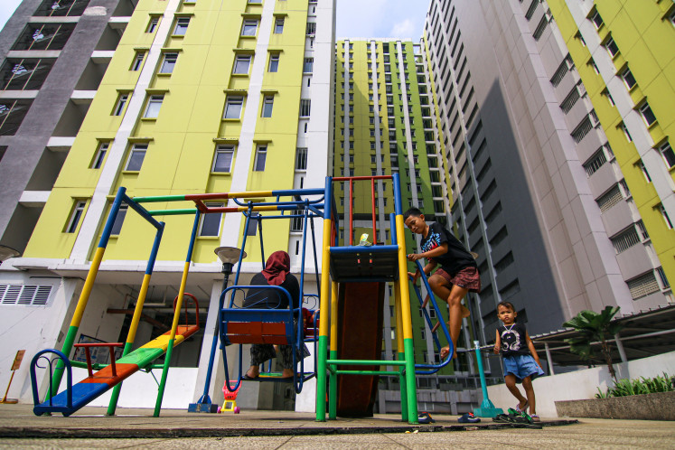 Children play at the Pasar Rumput low-cost apartment complex (rusun) in Jakarta on June 26, 2026. The Jakarta administration plans to build 11 new rusun complexes in several strategic locations starting in 2027 to expand access to decent housing and support the central government&rsquo;s program to build 3 million homes nationwide. 