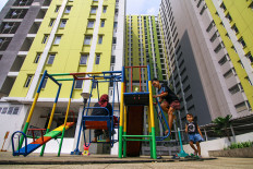 Children play at the Pasar Rumput low-cost apartment complex (rusun) in Jakarta on June 26, 2026. The Jakarta administration plans to build 11 new rusun complexes in several strategic locations starting in 2027 to expand access to decent housing and support the central government&rsquo;s program to build 3 million homes nationwide. 