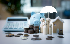 An illustration depicts financial planning and family security, symbolizing the economic stability many young people consider a prerequisite for marriage and parenthood.