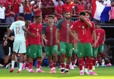 Morocco's Amine Sbai looks dejected with teammates after the FIFA World Cup 2026's quarterfinals match against France at the Boston Stadium in Massachusetts, the United States on July 9, 2026.
