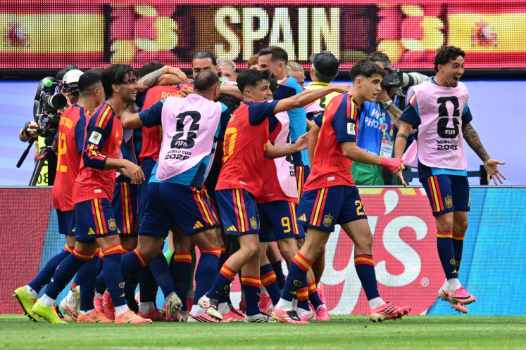 Spain's players celebrate after midfielder #06 Mikel Merino (unseen) scores the second goal during the 2026 World Cup football tournament quarter-final match between Spain and Belgium at the Los Angeles Stadium in Inglewood on July 10, 2026.