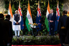 India's Prime Minister Narendra Modi (left) and New Zealand Prime Minister Christopher Luxon (right) pose during an Exchanging of Arrangements at Government House in Auckland, New Zealand on July 11, 2026.