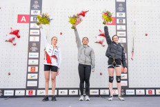 Top of the world: Indonesian climber Desak Made Rita Kusuma Dewi (center) celebrates her victory in the women's individual speed event final on July 5, 2026, flanked by Poland&rsquo;s Natalia Kalucka (left) as runner-up and the United States&rsquo; Emma Hunt, at the IFSC World Climbing Series Krakow 2026 in Poland.