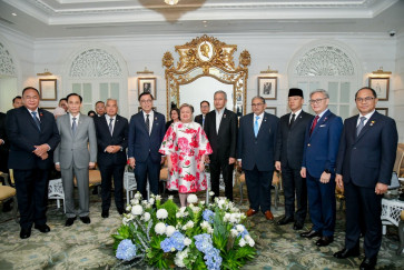 This handout photo taken and released by Thailand's Ministry of Foreign Affairs on July 12, 2026 shows (from left to right) Timor-Leste's Foreign Minister Bendito dos Santos Freitas, Vietnam's Foreign Minister Le Hoai Trung, Malaysia's Chief Secretary Shamsul Azri Abu Bakar, Thailand's Foreign Minister Sihasak Phuangketkeow, Philippines' Foreign Minister Maria Theresa Lazaro, Singapore's Foreign Minister Vivian Balakrishnan, Brunei's Foreign Minister Erywan Yusof, Indonesia's Foreign Minister Sugiono, Laos' Foreign Minister Thongsavanh Phomvihane and Myanmar's Foreign Minister U Tin Maung Swe posing for a photo during an informal meeting with ASEAN Foreign Ministers in Bangkok.