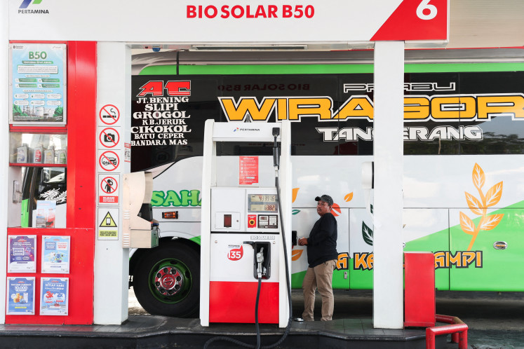 A driver refuels on July 9, 2026, a vehicle with biodiesel containing 50 percent diesel fuel made of palm oil at a petrol station in Karawang, West Java. 