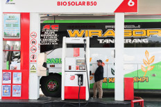 A driver refuels on July 9, 2026, a vehicle with biodiesel containing 50 percent diesel fuel made of palm oil at a petrol station in Karawang, West Java. 