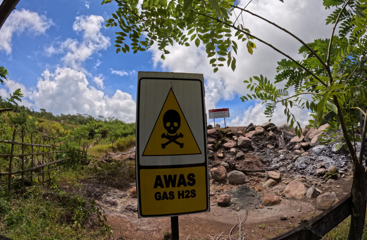 Danger zone: A hydrogen sulfide warning sign stands near a geothermal project in Ijen Blawan, Bondowoso, East Java, in this undated photo. Hydrogen sulfide is a toxic gas commonly found around geothermal and volcanic sites.