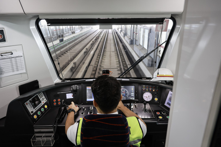 An LRT Jakarta train driver prepares to operate a train on July 14 at Rawamangun Station in East Jakarta. The 12.2-kilometer Pegangsaan Dua-Manggarai extension has reached around 95 percent completion and is expected to begin operations in August. 