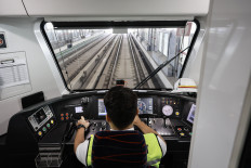 An LRT Jakarta train driver prepares to operate a train on July 14 at Rawamangun Station in East Jakarta. The 12.2-kilometer Pegangsaan Dua-Manggarai extension has reached around 95 percent completion and is expected to begin operations in August. 