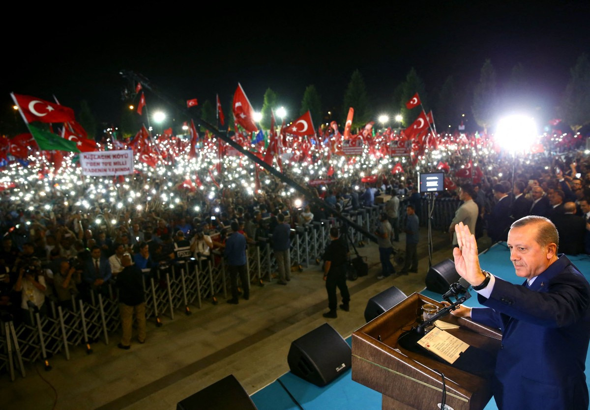 Turkish President Recep Tayyip Erdogan addresses people gathered at the Presidential Complex to protest the July 15th failed military coup attempt in Ankara, Turkey on Aug. 10, 2016.