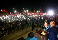 Turkish President Recep Tayyip Erdogan addresses people gathered at the Presidential Complex to protest the July 15th failed military coup attempt in Ankara, Turkey on Aug. 10, 2016.