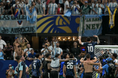 Argentina's forward #10 Lionel Messi and teammates celebrate after winning the 2026 World Cup soccer tournament semi-final match between England and Argentina at the Atlanta Stadium in Atlanta, the United States on July 15, 2026. 