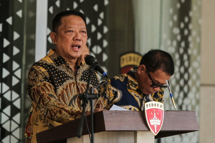 Then-asssitant attorney general for special crimes (Jampidsus) Febrie Adriansyah (left) speaks during a press briefing at the Attorney General's Office (AGO) building in South Jakarta on July 10, 2026. Febrie resigned from his position early July 11, hours after the press briefing in which he denied wrongdoings and involvement in corrupt practices.