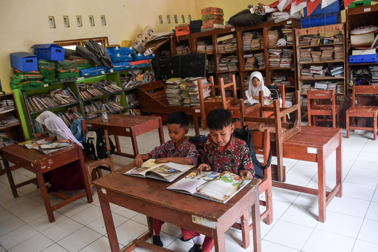 Students attend class at the SDN 2 Salakaria state elementary school in Ciamis regency, West Java on July 15, 2026. The school only had one new student for the 2026/2027 academic year as most of nearby residents are elderlies with no school-age children.