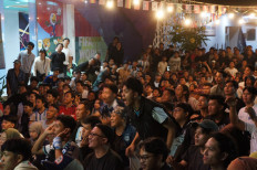 An Argentina supporter reacts during the public screening of the World Cup 2026 semifinal between England and Argentina at the headquarters of state-owned broadcaster TVRI in Senayan, Central Jakarta, on July 16, 2026. 