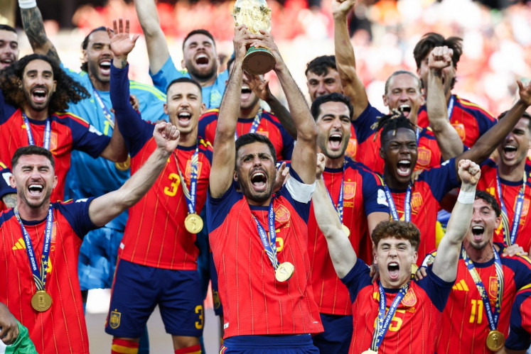 Spain's midfielder #16 Rodri lifts the trophy with his teammates after winning the 2026 World Cup soccer tournament final match between Spain and Argentina at the New York/New Jersey Stadium in East Rutherford, the United States on July 19, 2026.