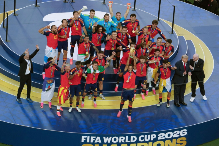Trump lingers on stage to lap up World Cup spotlight