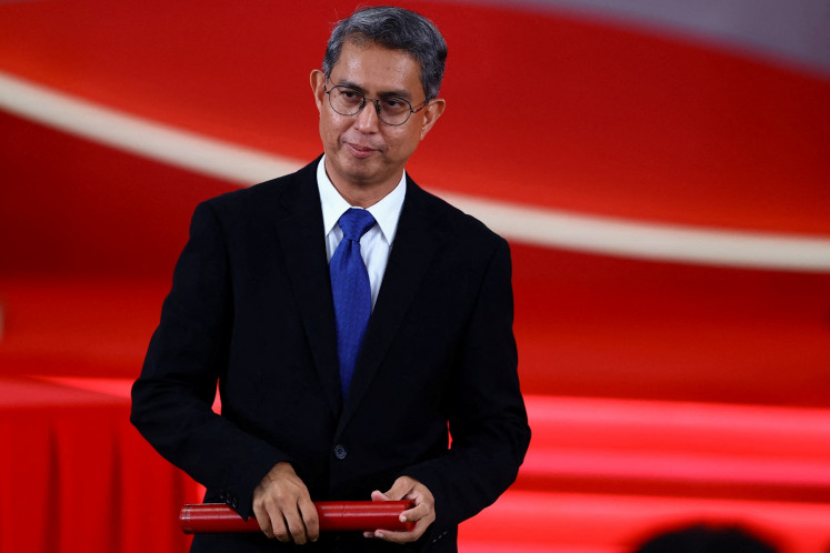 Faishal Ibrahim is sworn in as Singapore's Acting Minister-in-charge of Muslim Affairs and Senior Minister of State for Home Affairs, during a swearing-in ceremony at the Istana in Singapore on May 23, 2025. 