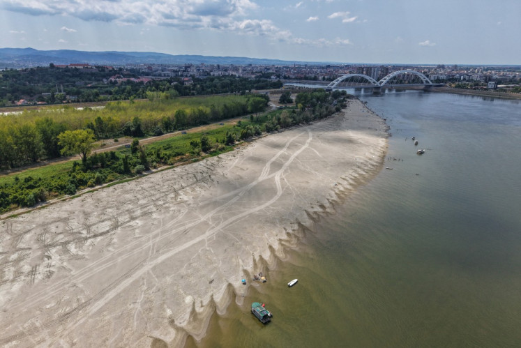 This aerial view shows the low water level of the Danube River near Novi Sad, Serbia, on July 19, 2026. 