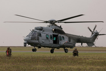 A French Air Force Airbus H225M Caracal Helicopter drops French Air Commandos as part of the French Air and Space Force military exercise Taranis (Tactical Airlift Rehearsal under Advanced Non-permissive and Intensive Scenarios), on the Orleans-Bricy air base, in Boulay-les-Barres on Nov. 14, 2025.