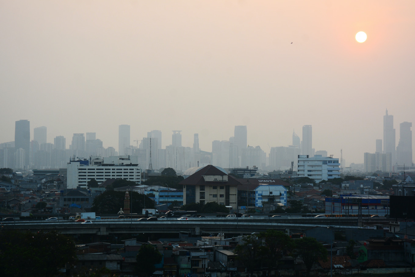 Skyscrapers in Jakarta are shrouded in haze on July 20 in East Jakarta. Jakarta's Air Quality Index (AQI) averaged between 120 and 168 in mid-July 2026, placing the city's air quality in the unhealthy category. Jakarta also hosts the headquarters of the ASEAN Coordinating Center for Transboundary Haze Pollution Control (ACC THPC) in Kebon Nanas, East Jakarta, which facilitates coordination among member states in addressing the impact of regional haze pollution.