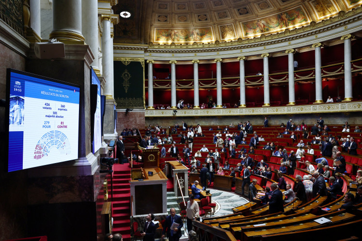 A screen shows the result of a vote on the bill that aims to ban social media access for children under the age of 15, at the National Assembly in Paris, France, July 21, 2026.