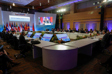 Chinese Foreign Minister Wang Yi (right) joins other foreign ministers during the Opening Statement of the ASEAN Post-Ministerial Conference with China at the Philippine International Convention Centre in Manila, the Philippines, on July 22, 2026.