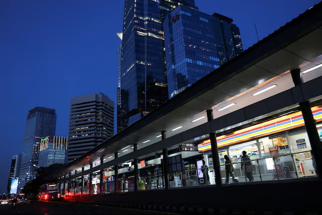 People wait at the Sudirman Central Business District (SCBD) bus shelter in South Jakarta on Sept. 2, 2025.