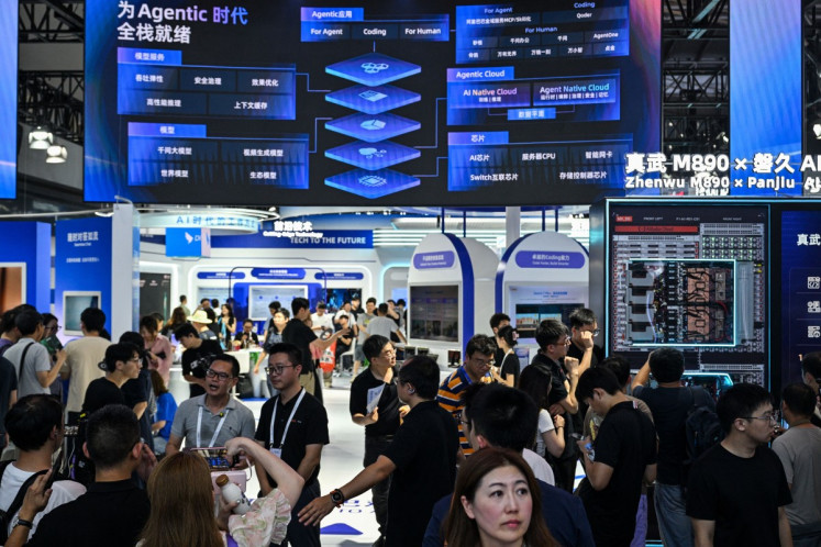 People visit the Alibaba booth during the World Artificial Intelligence Conference (WAIC) in Shanghai, China on July 18, 2026.