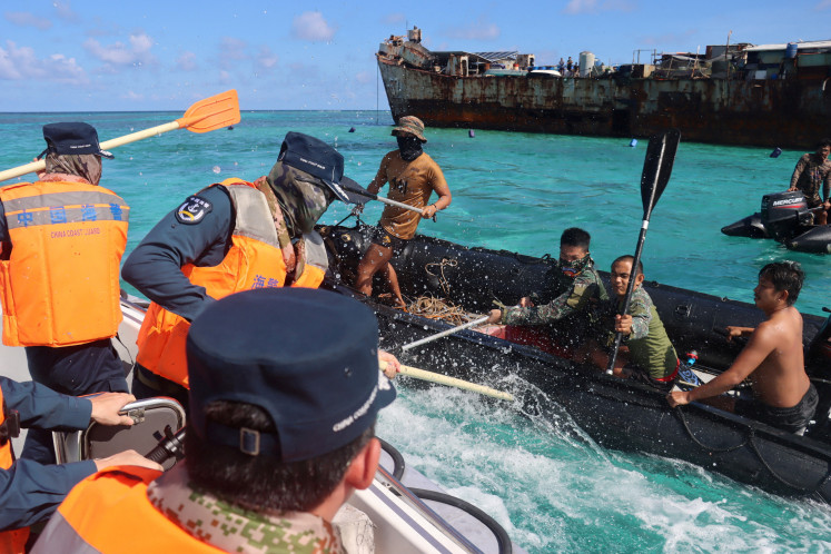 Philippine Navy personnel and China Coast Guard personnel clash near a grounded Philippine warship at Second Thomas Shoal, in the South China Sea, July 20, 2026.