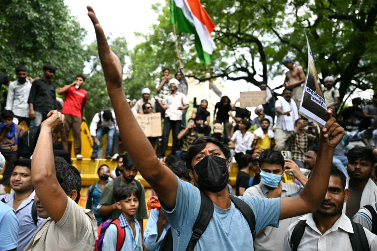 A Cockroach Janta Party (CJP) supporter shouts slogans at Jantar Mantar in New Delhi on July 23, 2026 during the ongoing protest to demand the resignation of India's Education Minister Dharmendra Pradhan over alleged NEET exam irregularities. Indian Prime Minister Narendra Modi on July 23 vowed &ldquo;stringent punishment&ldquo; for those involved in exam fraud that has fueled student anger, in his first direct comments tied to major protests challenging his government.