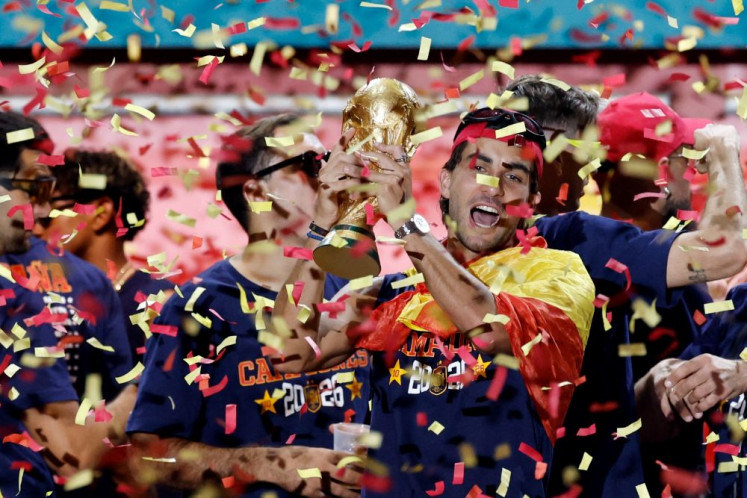 Heroes&rsquo; welcome: Spain forward Ferran Torres (center right) raises the FIFA World Cup 2026 trophy as his teammates celebrate on a stage at Cibeles Square in Madrid on July 20, 2026, one day after winning the country&rsquo;s second World Cup title with a 1-0 victory over Argentina.