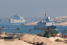 A handout picture released by the Marine Nationale (French Navy) on May 6, 2026 shows the French Navy's Carrier Strike Group that includes the flagship aircraft carrier Charles de Gaulle (unseen) and its escort transiting the Suez Canal en route to the southern Red Sea to pre-position for a possible mission to restore navigation in the Strait of Hormuz. 