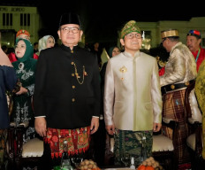Jakarta Governor and senior Indonesian Democratic Party of Struggle (PDI-P) member Pramono Anung (left) joins National Awakening Party (PKB) chairman Muhaimin Iskandar during the inauguration of PKB local branch leaders on July 22 at Fatahillah Square in Jakarta.