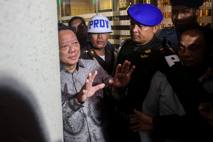 Former deputy attorney general for special crimes Febrie Adriansyah (left) speaks to reporters after questioning at the Attorney General's Office in Jakarta on July 24, 2026. 
