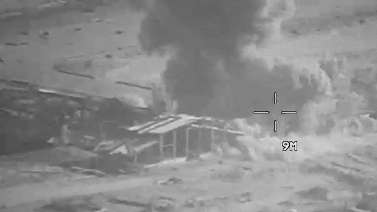 Smoke rises from an explosion at an unknown location, during what the United States Central Command (CENTCOM) says are strikes on Iranian military targets, in this screengrab taken from a handout video released on July 23, 2026.