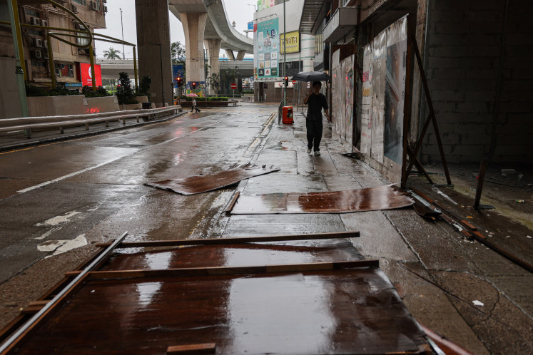 Fallen construction hoarding lies on the ground after strong winds from Typhoon Noul, in Hong Kong, July 26, 2026.