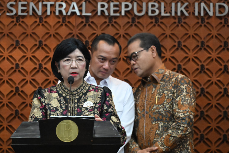 Bank Indonesia (BI) Senior Deputy Gov. Destry Damayanti (left), State Secretary Prasetyo Hadi (center) and BI Deputy Gov. Ricky P. Gozali, speak during a press conference on the resignation of BI Gov. Perry Warjiyo in Jakarta, on July 27, 2026. Perry Warjiyo submitted his resignation, and Destry Damayanti was appointed acting governor of BI in accordance with the central bank's regulation. 
Antara/Marco