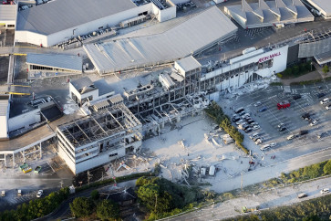 An aerial view shows the damaged Aeon Mall shopping center after an earthquake with a preliminary magnitude of 7.1 struck Japan's southern Kumamoto prefecture, in Kashima Town, Kumamoto Prefecture, Japan, July 28, 2026.