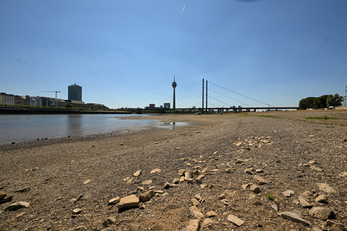 The partially dried-up river bed of the Rhine is pictured in Duesseldorf, western Germany, on July 28, 2026, following exceptionally hot weather. 