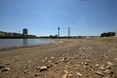 The partially dried-up river bed of the Rhine is pictured in Duesseldorf, western Germany, on July 28, 2026, following exceptionally hot weather. 