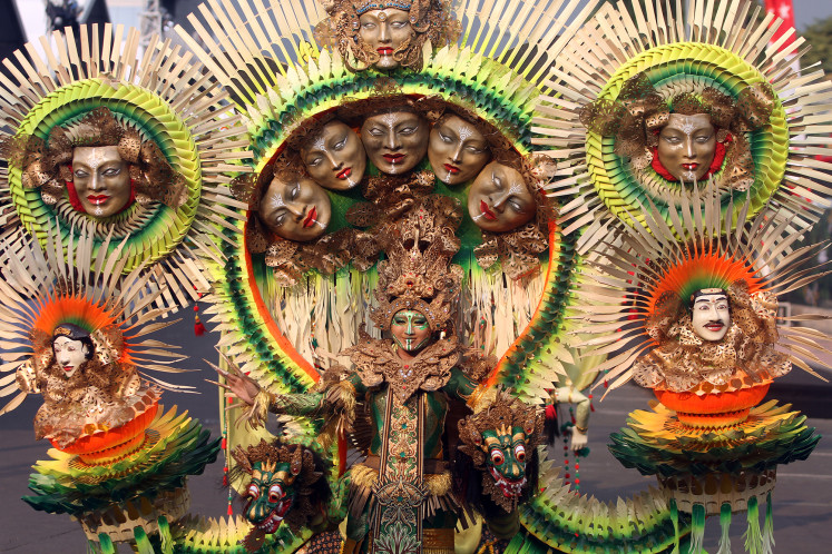 Noise in motion: A participant in the Noise defile performs on July 27, 2026, during the Grand Carnival of Jember Fashion Carnaval (JFC) 2026 in Jember, East Java. 