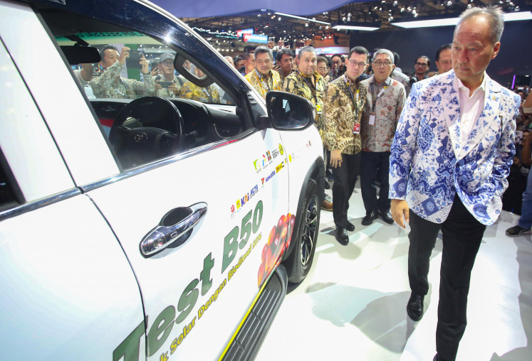 Industry Minister Agus Gumiwang Kartasasmita (right) accompanied by PT Toyota Motor Manufacturing Indonesia president director Nandi Julyanto (second right) and PT Toyota-Astra Motor vice president director Jap Ernando Demily, (third right) looks at a Toyota vehicle fueled with B50 biodiesel after opening the Gaikindo Indonesia International Auto Show (GIIAS) 2026 at the Indonesia Convention Exhibition (ICE) in BSD, Tangerang, Banten, on July 30, 2026.