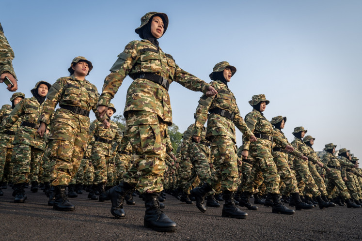 Manager candidates of the Red and White Cooperatives march in full camo outfits on July 31, 2026, prior to attending the closing ceremony for the Defense Ministry&rsquo;s Bachelor of Indonesian Development Drivers (SPPI) degree program at Halim Perdanakusuma Air Force Base in East Jakarta.