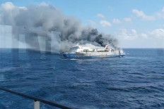 This screen grab from a handout video taken and released on August 2, 2026, by the National Search and Rescue Agency (Basarnas), shows the passenger ship Mutiara Sentosa 2 catching fire in the waters off Madura island, East Java. 