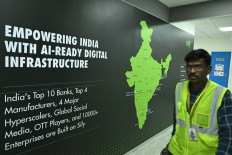 A man walks past signage of Sify Infinit Spaces at its data center at Rabale in Navi Mumbai, India, on July 20, 2026.