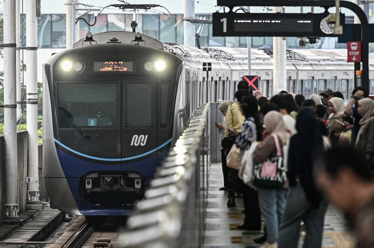Morning commute: Passengers wait for a Jakarta MRT train on July 3, 2026, at Blok M Station in South Jakarta.