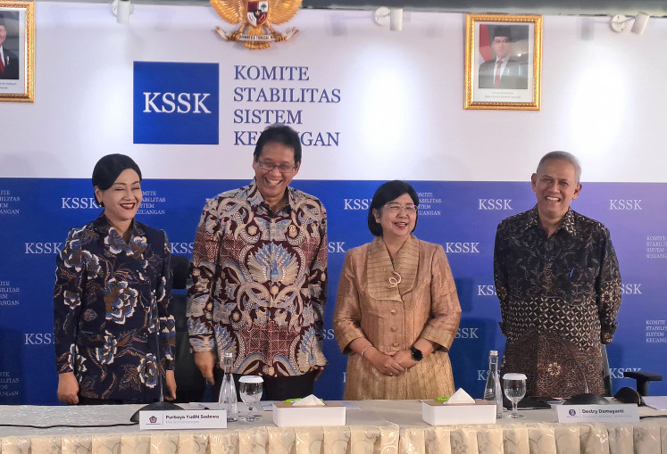 Financial Services Authority (OJK) chief Friderica Widyasari Dewi (left), Finance Minister Purbaya Yudhi Sadewa (second-left), interim Bank Indonesia (BI) governor Destry Damayanti (second right) and Indonesian Deposit Insurance Corporation (LPS) chairman Anggto Abimanyu pose for a photo in a press conference following the conclusion of Financial System Stability Committee (KSSK) meeting in Jakarta on Aug. 3, 2026.