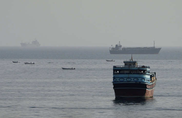 Vessels in the Strait of Hormuz, as seen from Musandam, Oman, August 3, 2026.